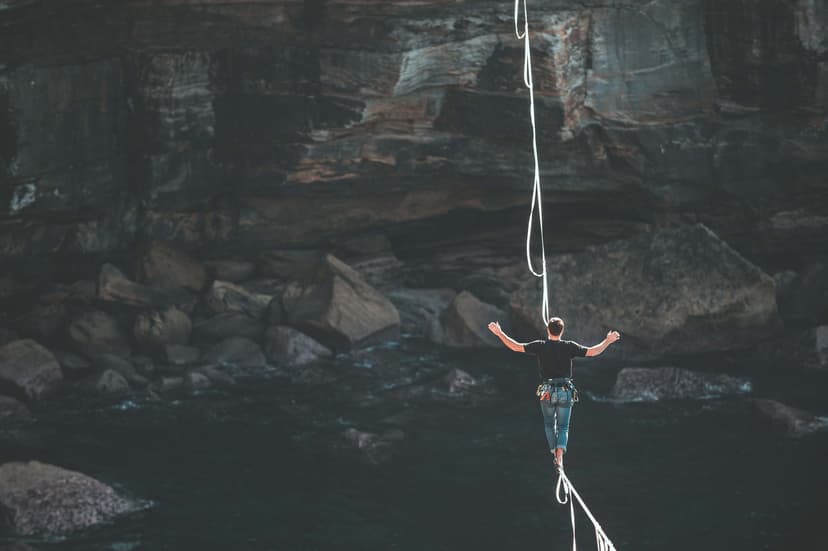 man walking on tight rope